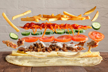 Traditional lavash dish with levitating ingredients from meat and vegetables.
