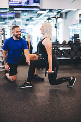 Woman exercising with personal trainer