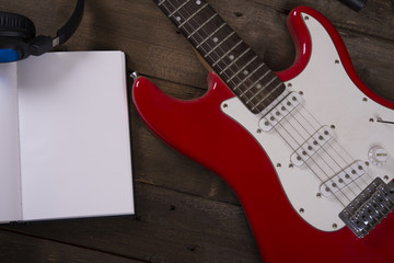 Fototapeta premium Electric guitar wallpaper with writing pad