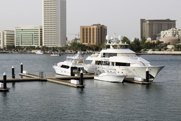 Fototapeta na wymiar Luxury Yachts moored in a harbour of Dubai.