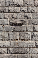 Wall of granite stones. Background and texture.
