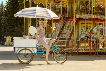 Modern chick on the blue bicycle