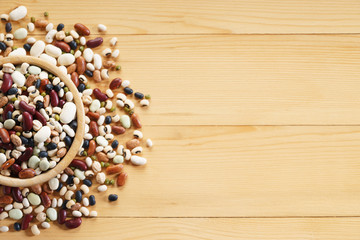 mixed beans on wooden background