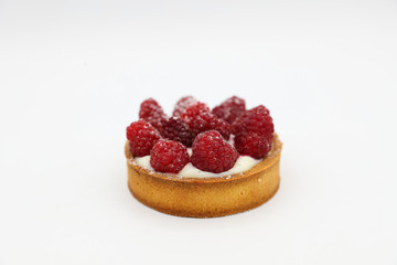 Tartlet with raspberry on white background