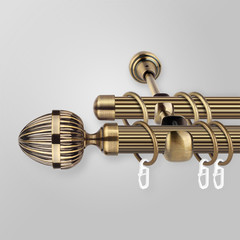 Metal curtain cornice and finials on the gray background. Metal ending for cornices. © SOLOTU