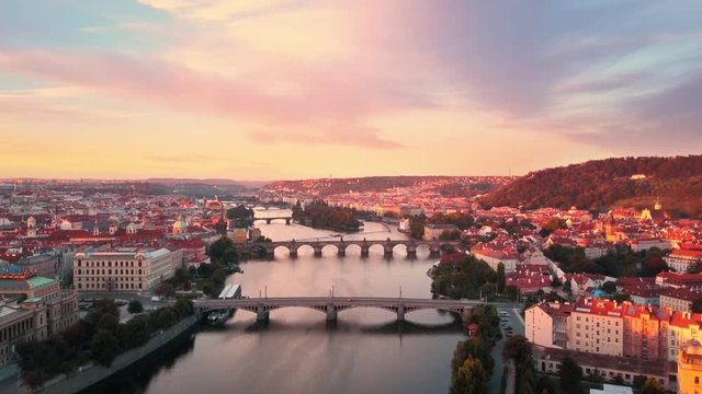 prague aerial shot drone flight to charles bridge at sunrise