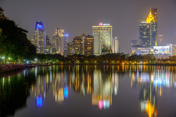 City downtown at night with reflection of skyline