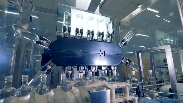 Bottles on a special conveyor, close up. Automatic factory equipment.