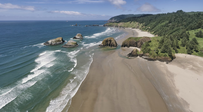 Aerial panorama shot at approximately 350 feet above Cannon Beach looking towards Ecola State Park in the summer on the Oregon Coast