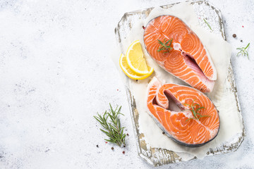 Salmon steak fresh fish with spices top view.