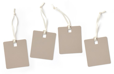 set of four elegant blank hangtags in different positions isolated on a white background, subtle shadows, copyspace for text or single letters, e.g. SALE