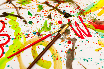 Children's drawing in colorful colors. Close, top view. Children's entertainment, family leisure