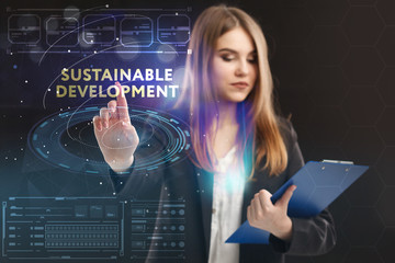 The concept of business, technology, the Internet and the network. A young entrepreneur working on a virtual screen of the future and sees the inscription: Sustainable development