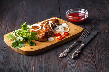 fried cutlet on the bone on cutting board
