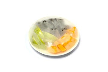 Fruits which are wrapped with plastic film preservation on a table on white background, concept Preserving the freshness of food.