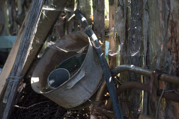 Rustic utensils at the fence. Russia.