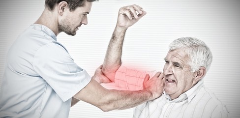 Obraz premium Composite image of physiotherapist assisting senior man to