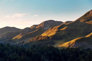Naklejka na ściany i meble New Zealand hills scenery before sunset.Amazing landscapes