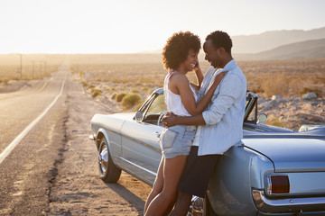 Romantic Couple Enjoying Road Trip In Classic Car 