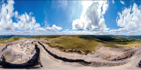 360 degree seamless aerial panorama of an old quarry located in a hilly, rural area of South Wales