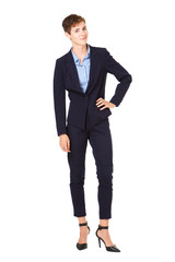 Full body young businesswoman in formal suit isolated against white background
