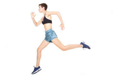 Full length active young woman jumping on isolated white background