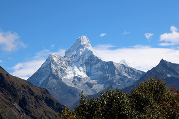 Fototapeta premium Amazing Shot of Nepalese himalayas mountain peaks covered with white snow attract many climbers and mountaineers