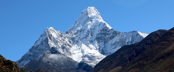 Wonderful view of mountain Ama Dablam in the Mount Everest range, iconic peak of Everest trekking...