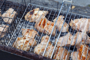 Barbecue is fried on the grill. Close-up.