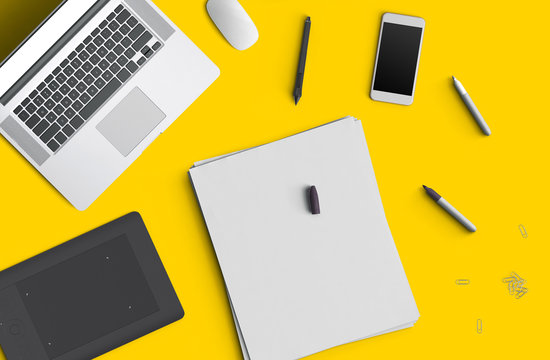 Minimal work space concept: smart phone, pen, pencils, notepad, notebook, tablet, laptop, composition on yellow background. Flat lay, top view