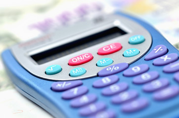 Close-up of calculator on money - concept of financial background