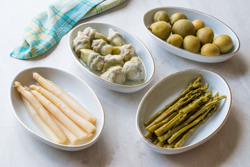 Pickled Vegetables Green and White Asparagus, Artichoke Heart and Unripe Green Almond Pickles in Plate