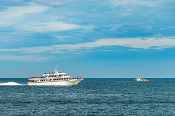 Fototapeta na wymiar Ship and boat looking for a whale Provincetown, Cape Cod, Massachusetts, US