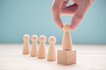 Successful team leader, Businessman hand choose people standing out from the crowd.
