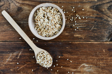 white sesame seed, sesame seed in wooden Cup on natural wooden background in rustic style