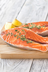 Raw trout steaks on the wooden board