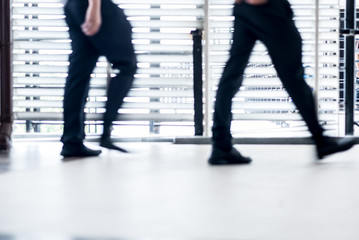 Blurred image of leg people walking