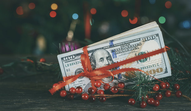American dollars as a Christmas gif t or a Christmas spending concept