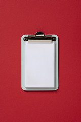 mockup Clipboard on red background. Flat lay, top view trendy for banner
