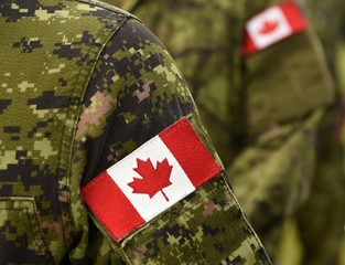 Canada patch flags on soldiers arm