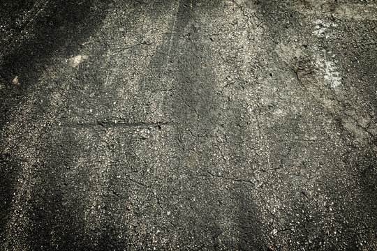 Dark stone asphalt with grimey rustic filth.