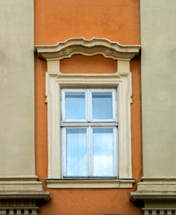 Texture of a vintage window with columns on an orange wall. Close-up,