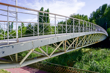 metal bridge of white color on the river carrion in the city of Palencia