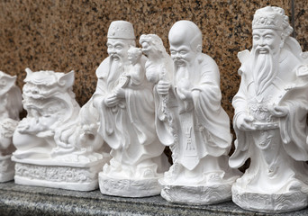 SAIGON, VIETNAM - JANUARY 04, 2015 - Statuettes representing Buddhist deities