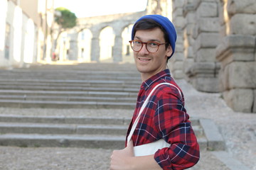 Male student with glasses close up