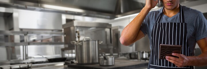 Composite image of waiter talking on mobile phone while holding
