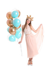 Fototapeta na wymiar Young woman with crown and air balloons on white background