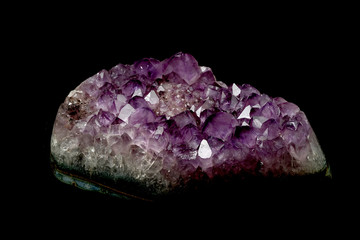 part of mineral purple Amethyst crystal quartz texture background with black isolated background and have some space for write wording