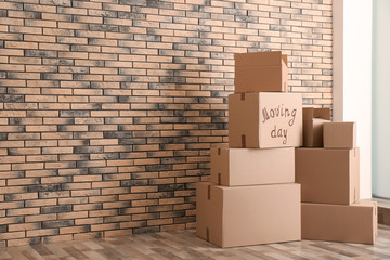 Pile of moving boxes in empty room