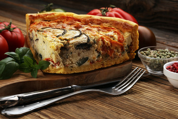 Homemade Cheesy Egg Quiche for Brunch with Spinach and Tomato, onions and zucchini.